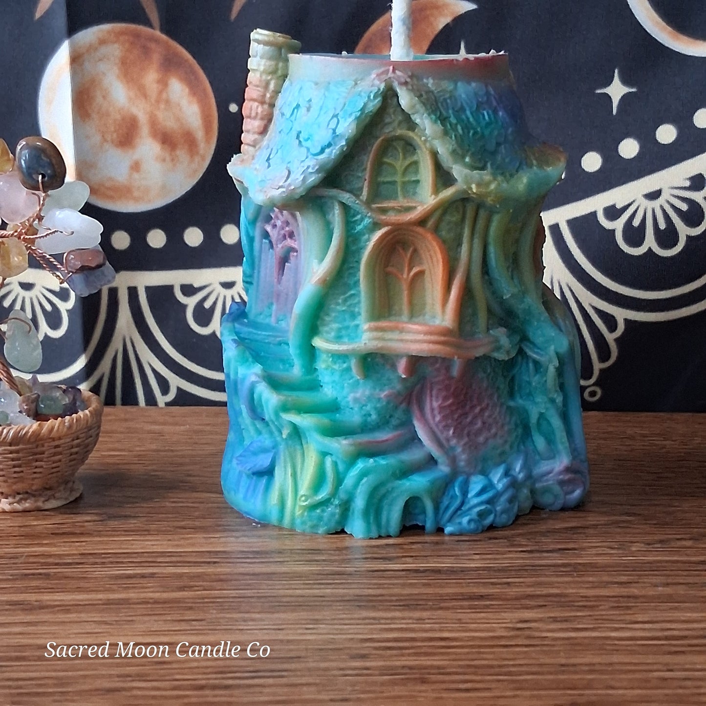 Rainbow Sherbert Sweet Blossom Scented Treehouse Candle by Sacred Moon Candle Co in pastel colors shaped like a whimsical house