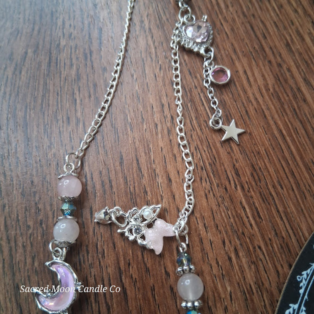 Sacred Moon Candle Co rose quartz pendulum for divination with silver chain and moon star charms