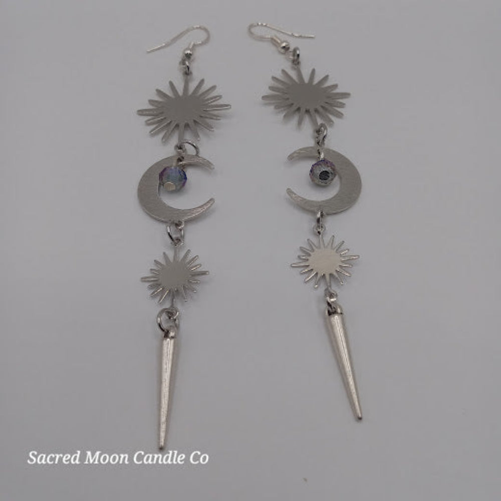 Sacred Moon Candle Co silver spiked moon dangle earrings with sun and crescent moon design