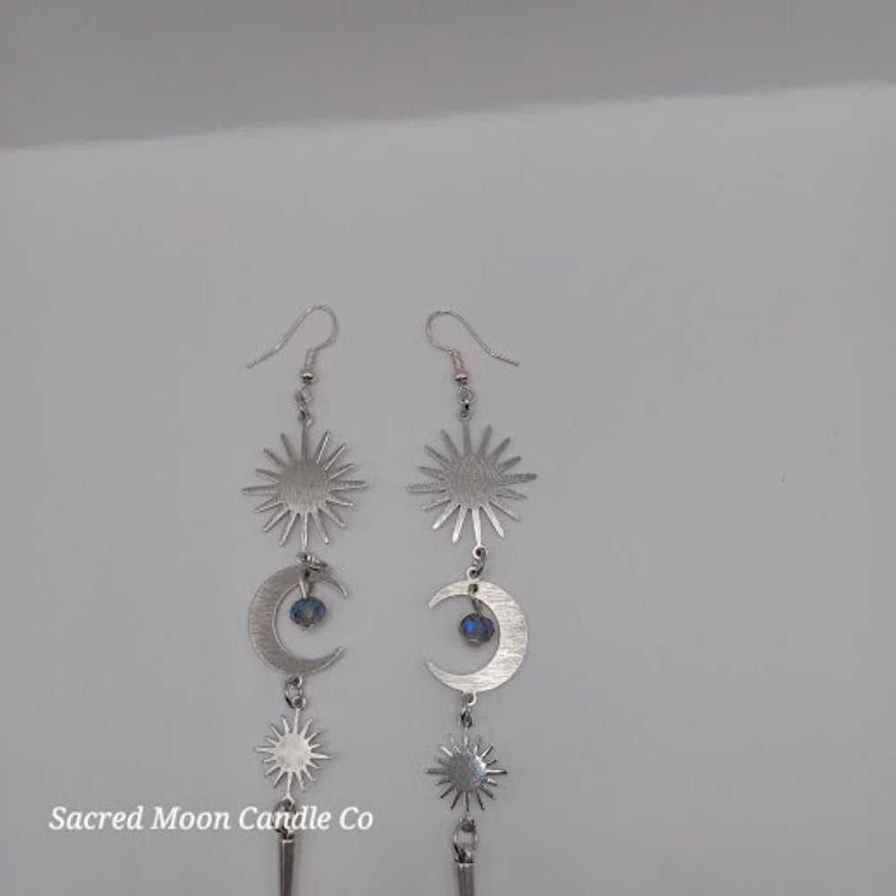 Silver spiked moon dangle earrings by Sacred Moon Candle Co with sun and crescent moon charms