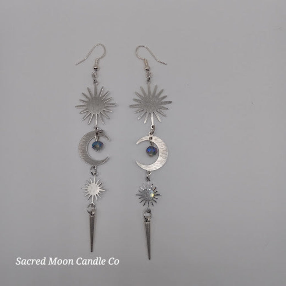 Sacred Moon Candle Co silver spiked moon dangle earrings with sun and crescent moon charms