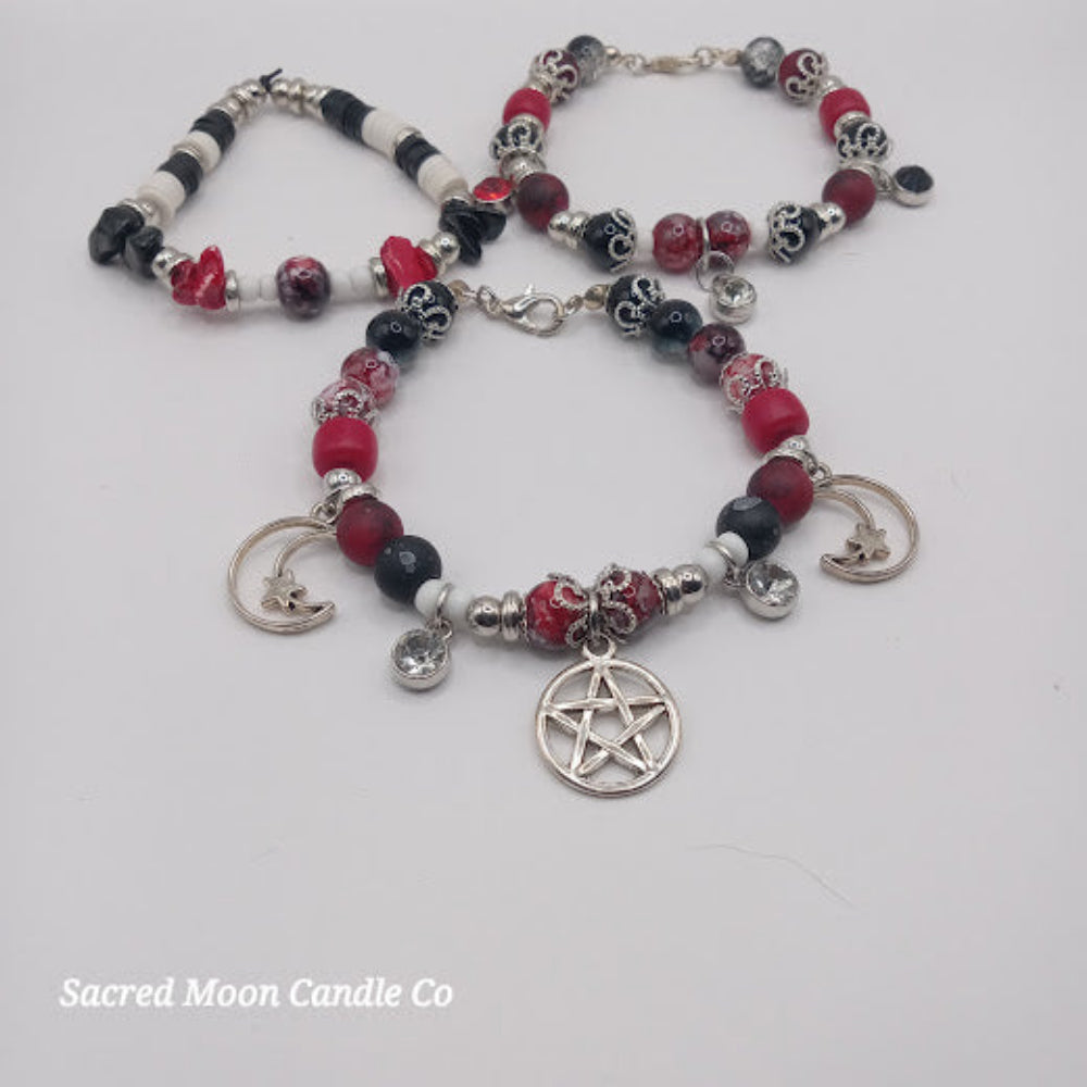 Triple Moon Goddess pentacle charm bracelet set by Sacred Moon Candle Co featuring red black beads and silver charms