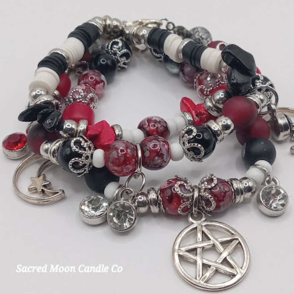Triple Moon Goddess pentacle charm bracelet set by Sacred Moon Candle Co with red, black, and white beads