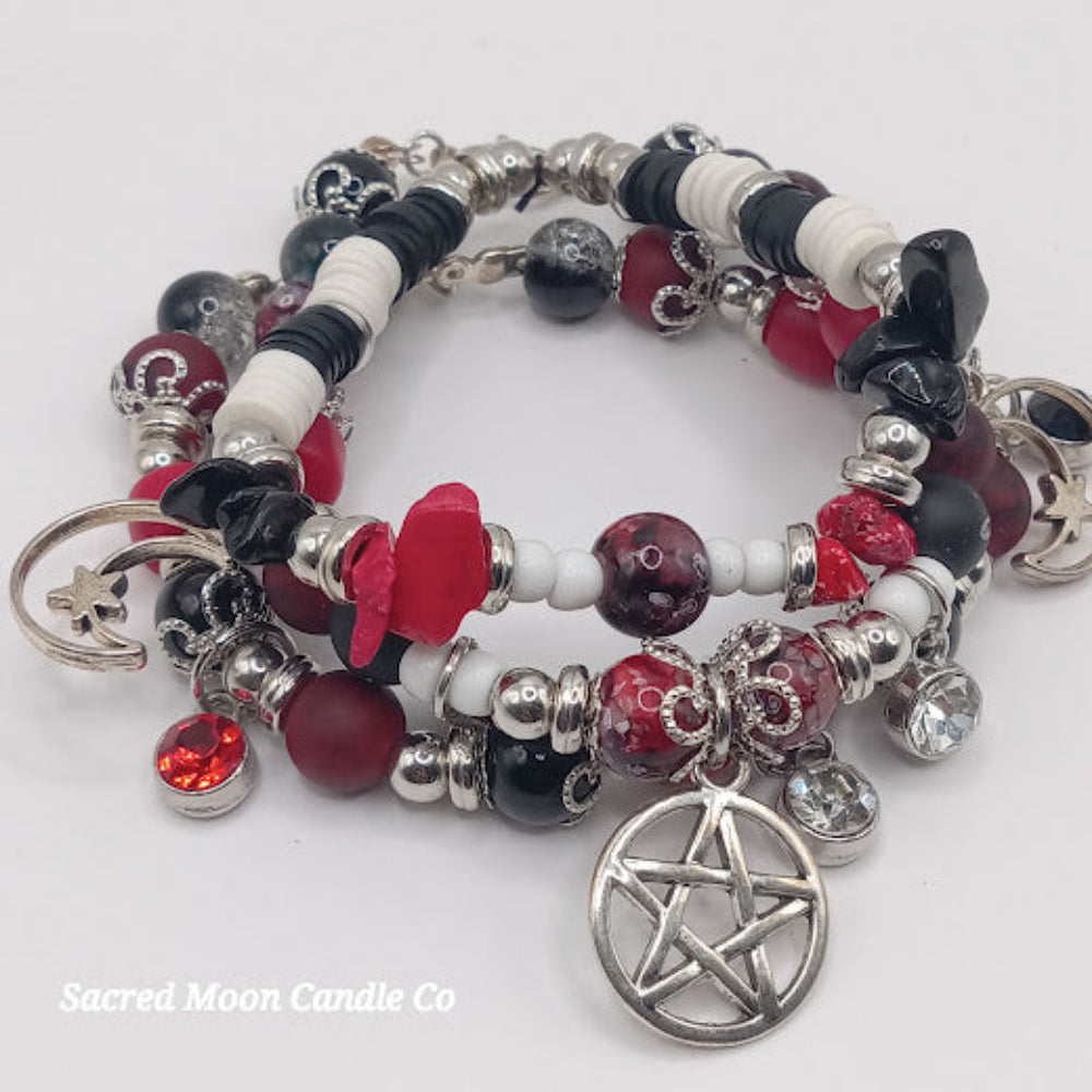 Triple Moon Goddess pentacle charm bracelet set by Sacred Moon Candle Co with red, black, white beads and silver charms