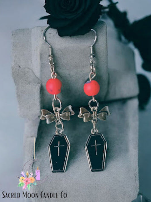 Coffin and bow dangle earrings with black coffin charms and silver bows by Sacred Moon Candle Co