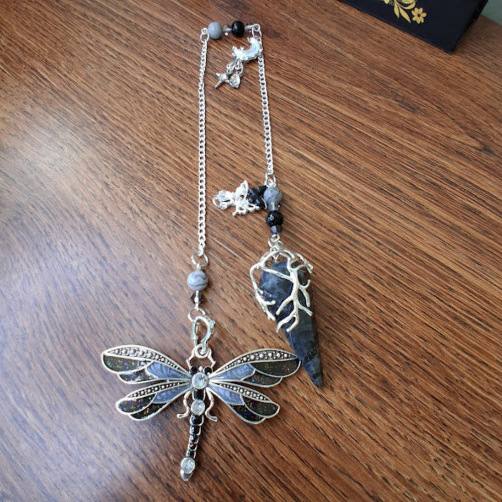 Larvikite moon pendulum with silver dragonfly charm and black stone on silver chain by Sacred Moon Candle Co