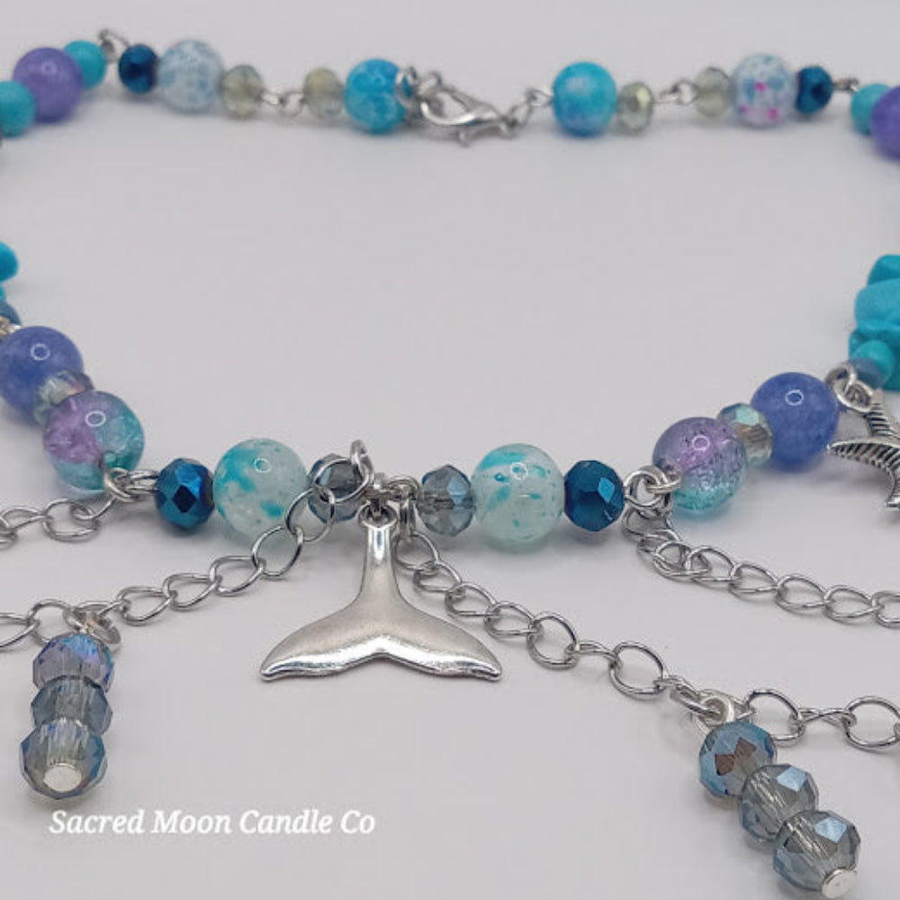 Sacred Moon Candle Co mermaid tail choker necklace with blue and purple beads and silver chains