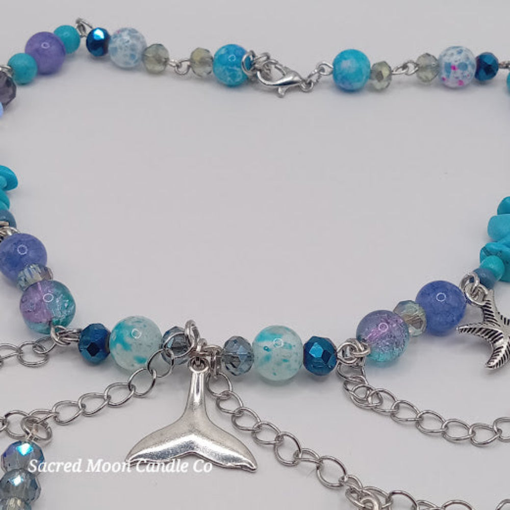 Mermaid tail choker necklace with blue and purple beads and silver chain details by Sacred Moon Candle Co