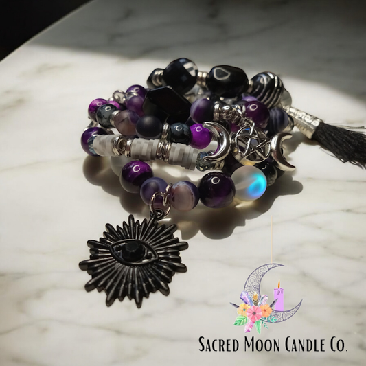Sacred Moon Candle Co spiritual protection beaded bracelets with purple and black beads and mystical charms
