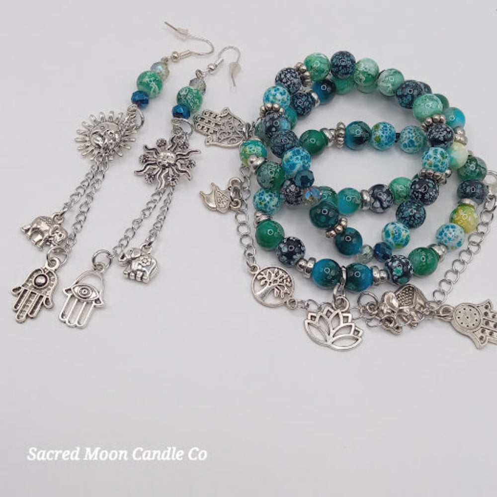 Teal boho earrings and bracelet stack featuring silver charms and blue-green beaded jewelry set