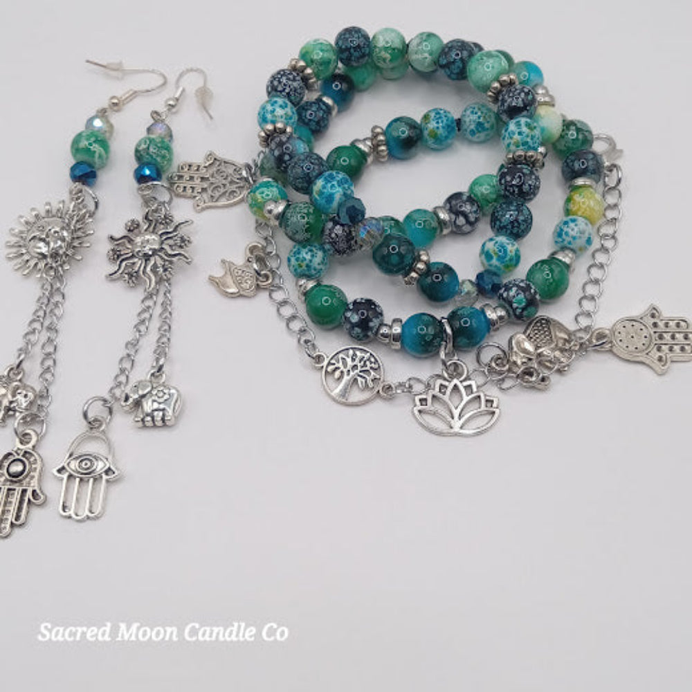 Sacred Moon Candle Co teal boho earrings and bracelet stack with silver charms and mixed beads