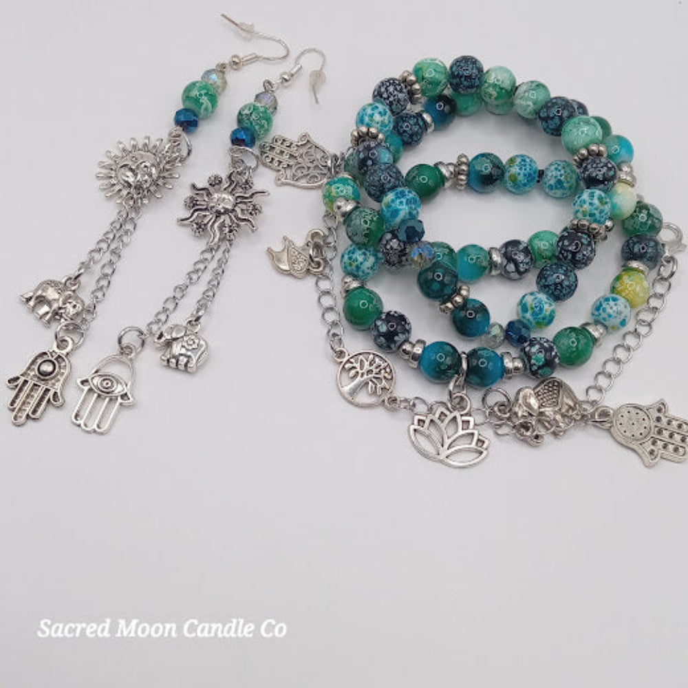 Teal boho earrings and bracelet stack with silver charms and multicolored beads by Sacred Moon Candle Co