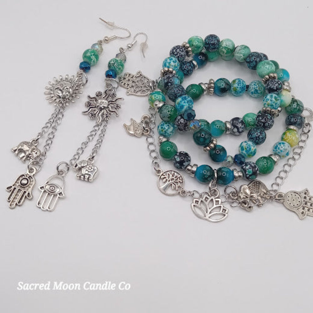 Teal boho earrings and bracelet stack with silver charms and blue green beads by Sacred Moon Candle Co