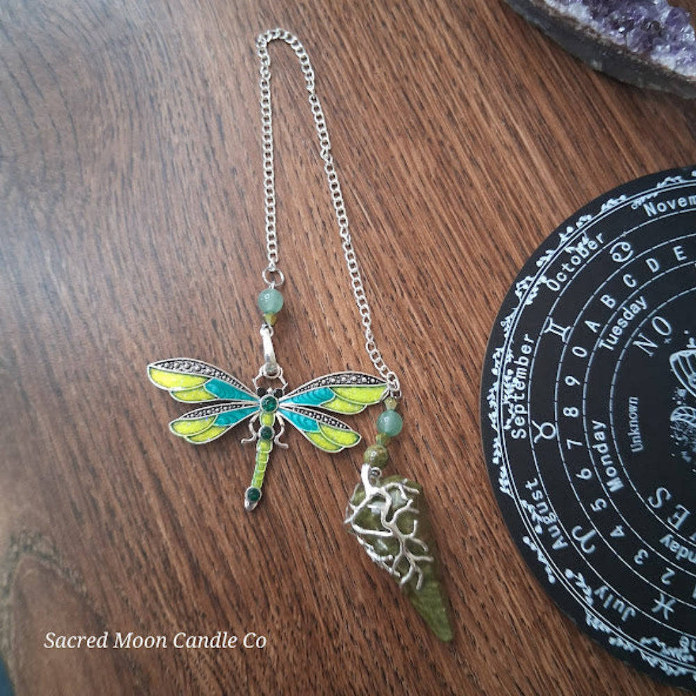 Unakite amazonite dragonfly pendulum from Sacred Moon Candle Co with colorful wings and green gemstone