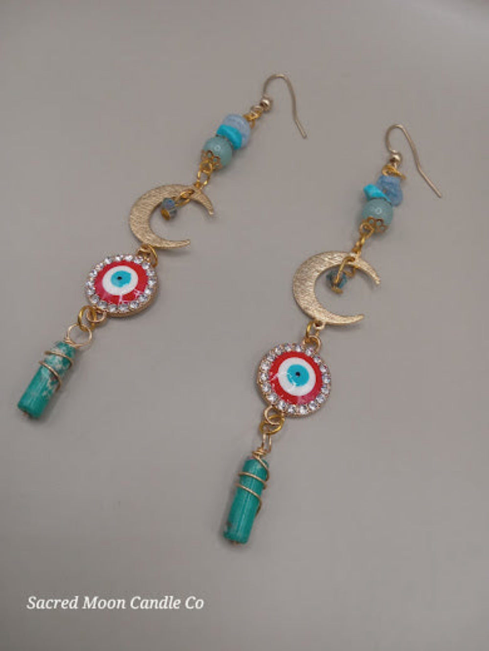 Sacred Moon Candle Co wire wrapped evil eye earrings with gold crescent and turquoise beads