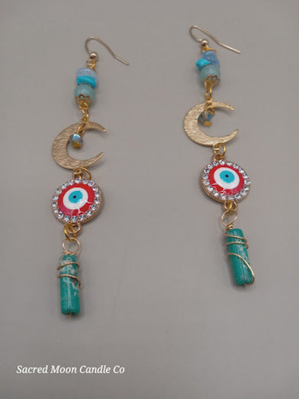 Wire wrapped evil eye earrings by Sacred Moon Candle Co featuring crescent moon and turquoise stones