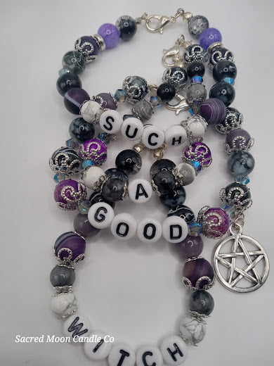 Sacred Moon Candle Co witch bracelet stack with purple black beads and silver pentagram charm