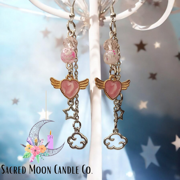 Sacred Moon Candle Co celestial dangle earrings with pink heart charms, star and cloud pendants
