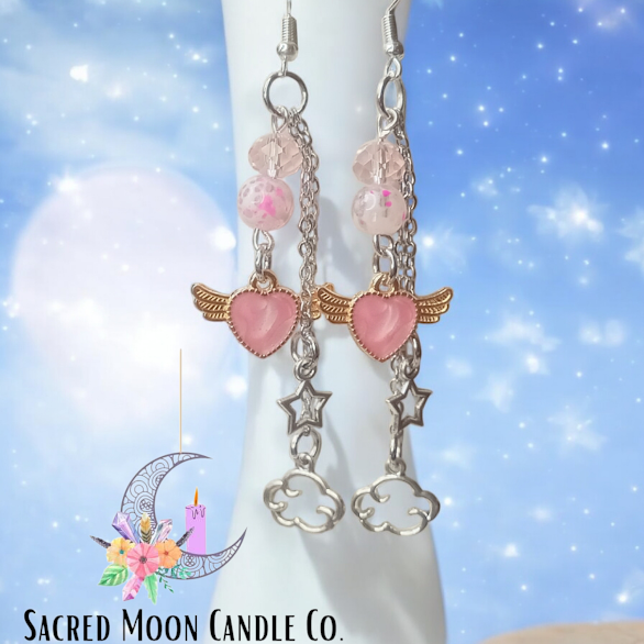 Sacred Moon Candle Co celestial dangle earrings with pink hearts wings stars and clouds charms