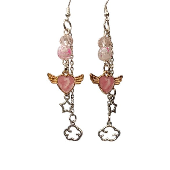 Sacred Moon Candle Co celestial dangle earrings with pink hearts, angel wings, stars, and clouds