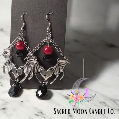 Sacred Moon Candle Co gothic bat jewelry set with silver bats, black and red beads, and dangling black teardrop earrings
