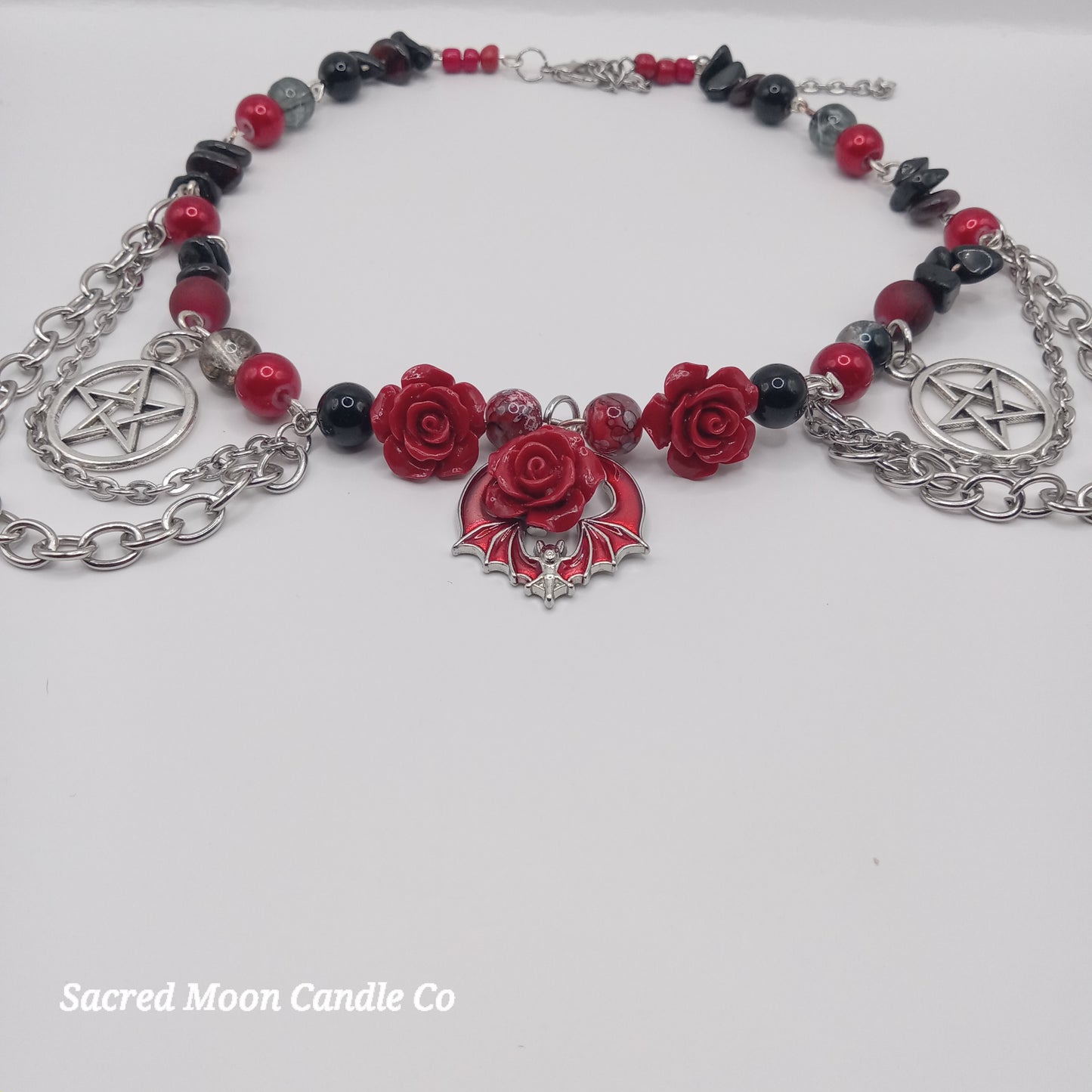 Handmade rose bat choker necklace by Sacred Moon Candle Co with red roses and silver chains