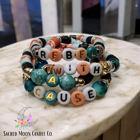 Rebel With A Cause bracelet stack with colorful beads and letter charms by Sacred Moon Candle Co