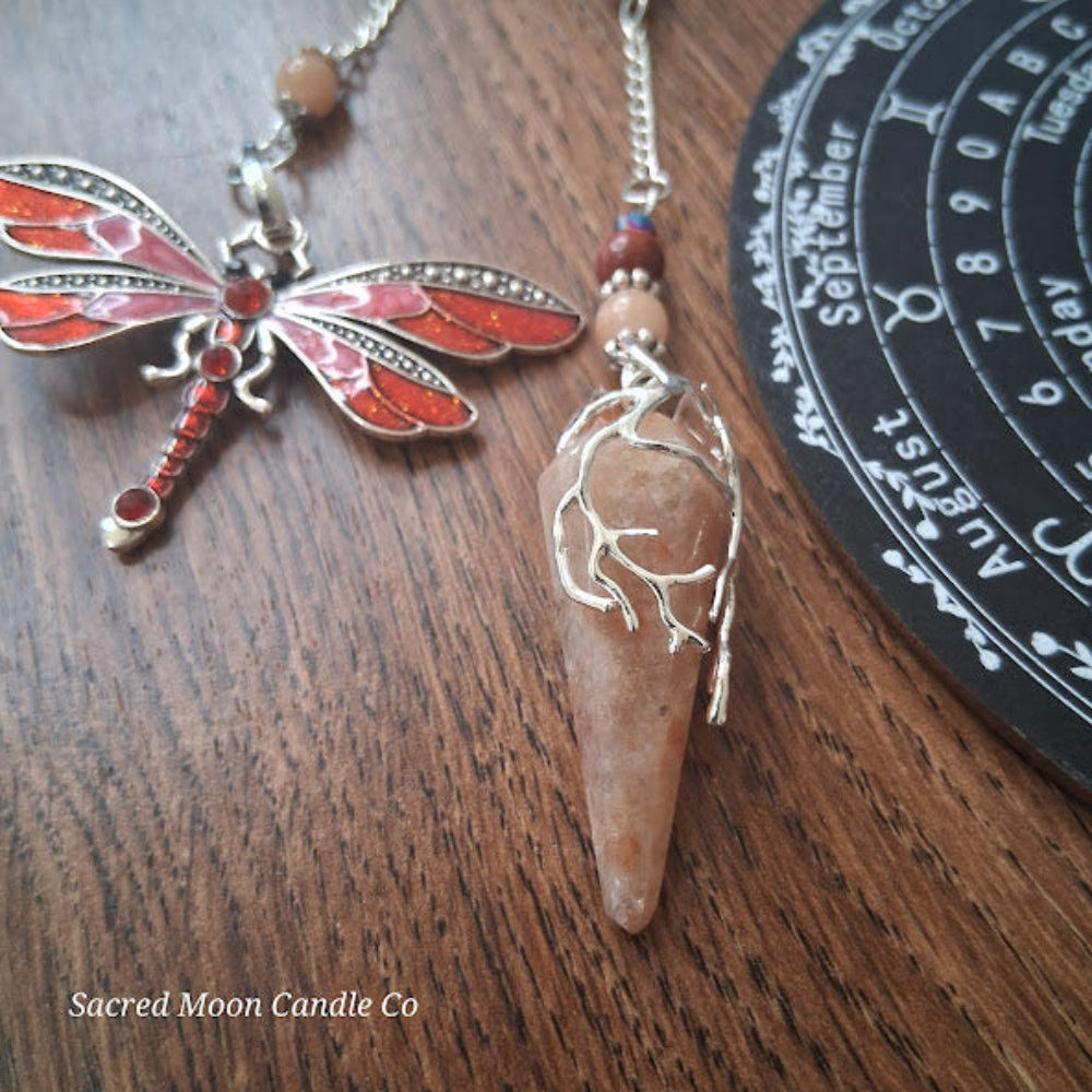 Sunstone dragonfly pendulum for divination with detailed dragonfly design and natural stone pendant