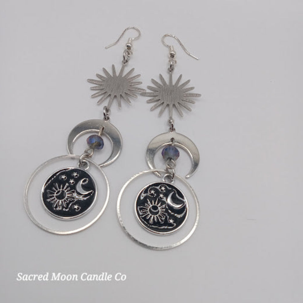Sacred Moon Candle Co celestial earrings for women featuring sun and moon designs with silver-tone metal accents