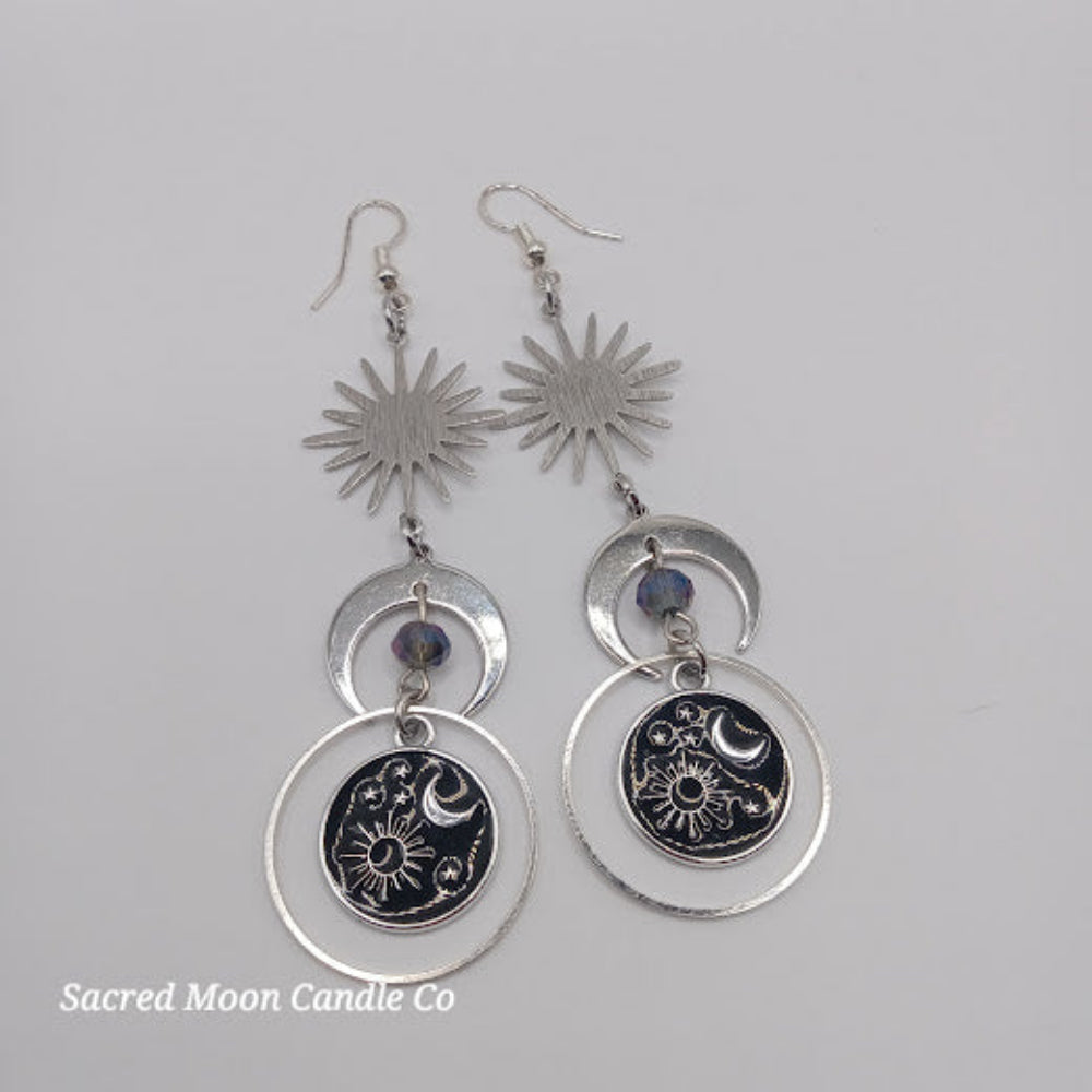 Sacred Moon Candle Co silver celestial earrings for women featuring sun, moon, and star designs