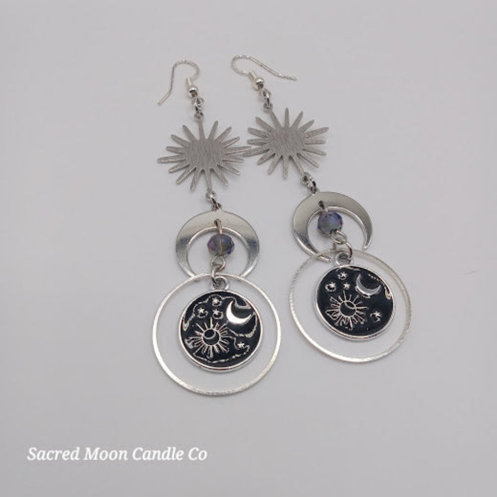 Sacred Moon Candle Co celestial earrings for women with sun, moon, and star designs in silver tones