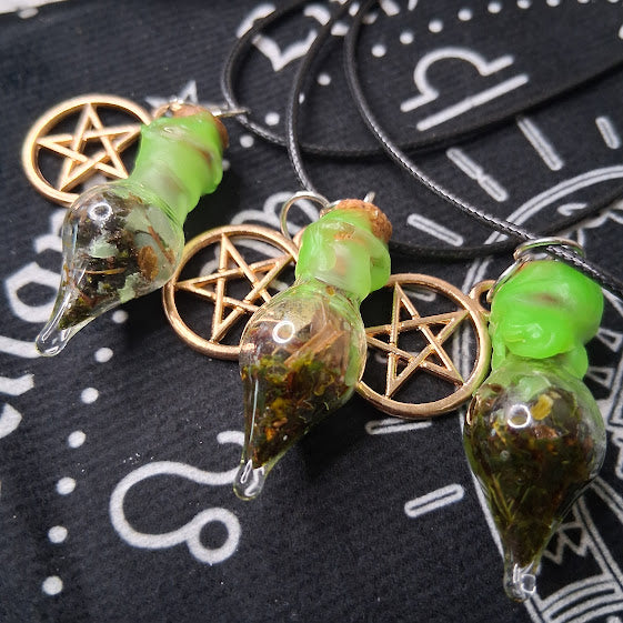 Sacred Moon Candle Co prosperity spell bottle necklace with green vial and pentacle charm on black cord