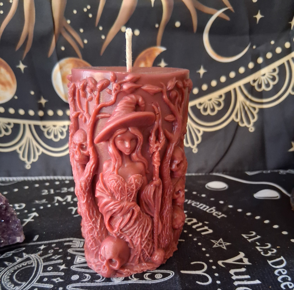 Siren's Blossom scented red witch pillar candle by Sacred Moon Candle Co with detailed witch and skull design