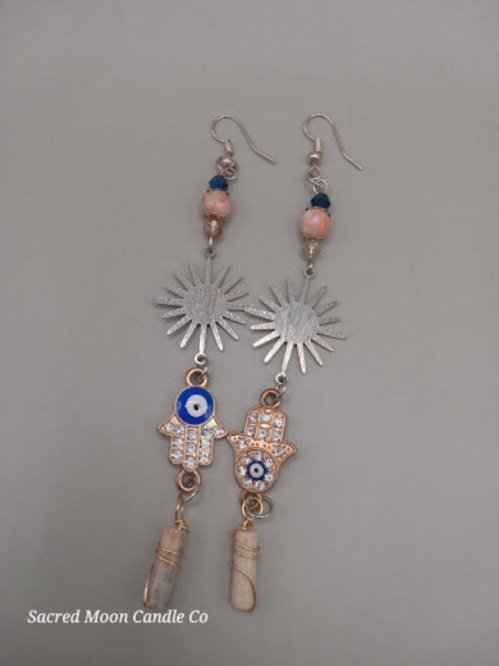 Sunburst Hamsa evil eye earrings with blue beads and silver sunburst charms by Sacred Moon Candle Co