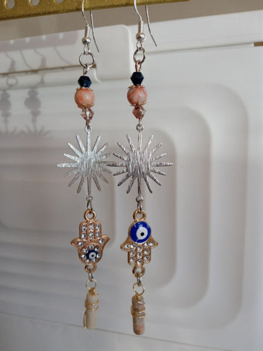 Sunburst Hamsa evil eye earrings by Sacred Moon Candle Co with silver sunburst and beaded details