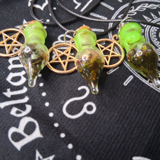 Sacred Moon Candle Co prosperity spell bottle necklace with green cap and pentagram charm on black cord