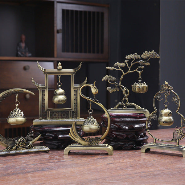 Sacred Moon Candle Co tranquility and prosperity incense burner set with intricate brass designs on wooden stands