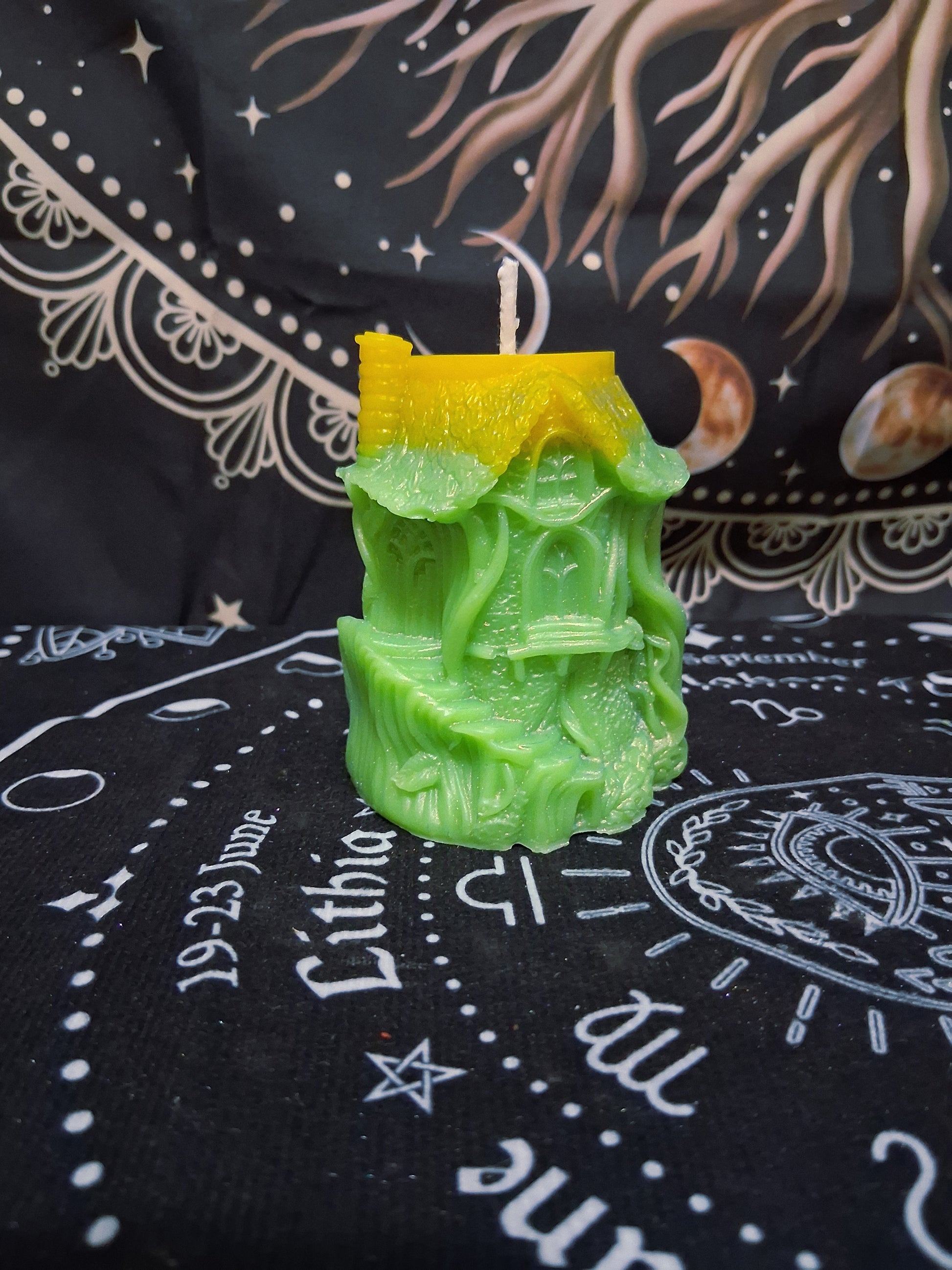 Sacred Moon Candle Co Citrus Canopy Hidaway Treehouse Candle in green and yellow resembling a detailed treehouse design
