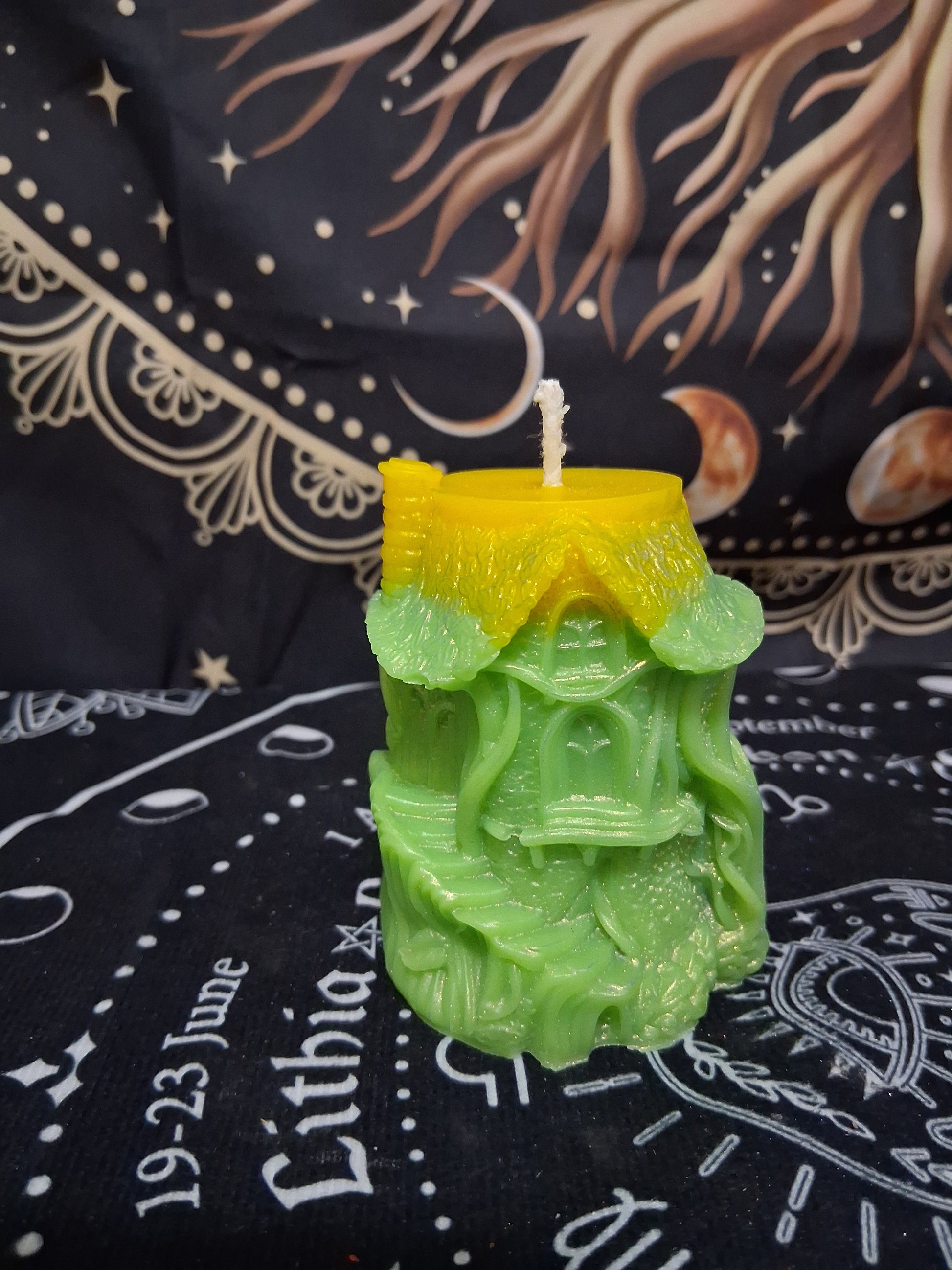 Sacred Moon Candle Co Citrus Canopy Hidaway Treehouse Candle shaped like a green treehouse with yellow roof