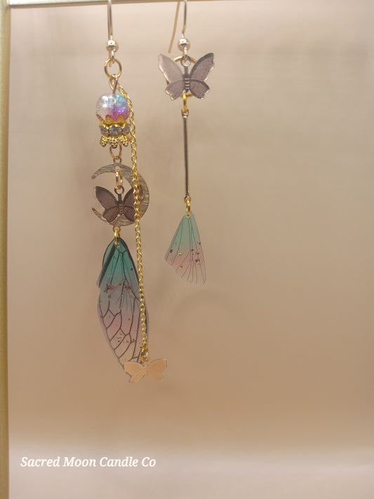 Sacred Moon Candle Co fairy wing earrings with delicate butterfly and pastel-colored wing charms