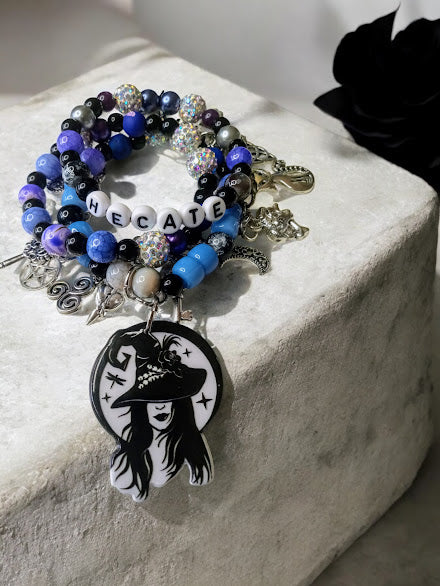 Sacred Moon Candle Co Hecate charm bracelet with blue beads and witch-themed charms
