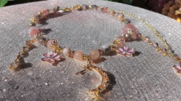 Sakura blossom moon choker from Sacred Moon Candle Co featuring pink beads and gold crescent moon pendant