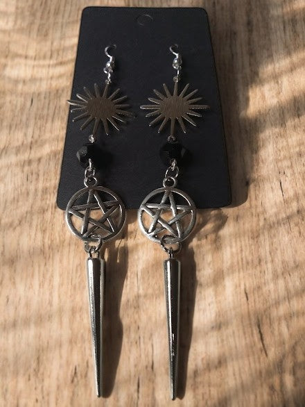 Sacred Moon Candle Co sunburst pentacle earrings with black bead and spike dangle design