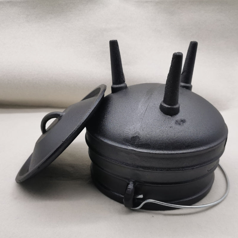 Sacred Moon Candle Co three-legged cast iron cauldron with lid and metal handle in black
