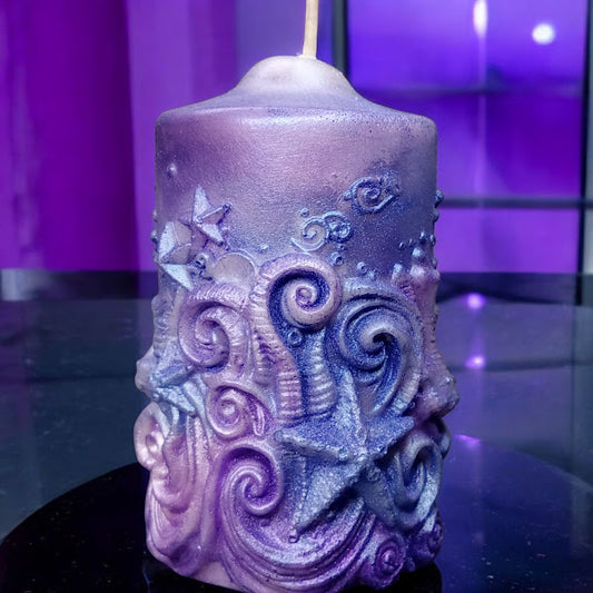 Purple ornate water lily jasmine scented candle by Sacred Moon Candle Co with starfish and swirl designs