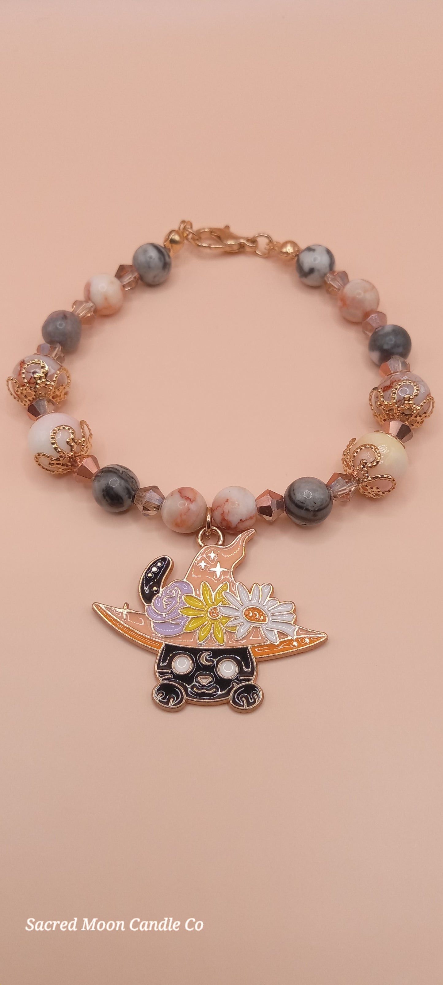 Sacred Moon Candle Co witchy cat charm bracelet with rose gold beads and detailed enamel cat charm