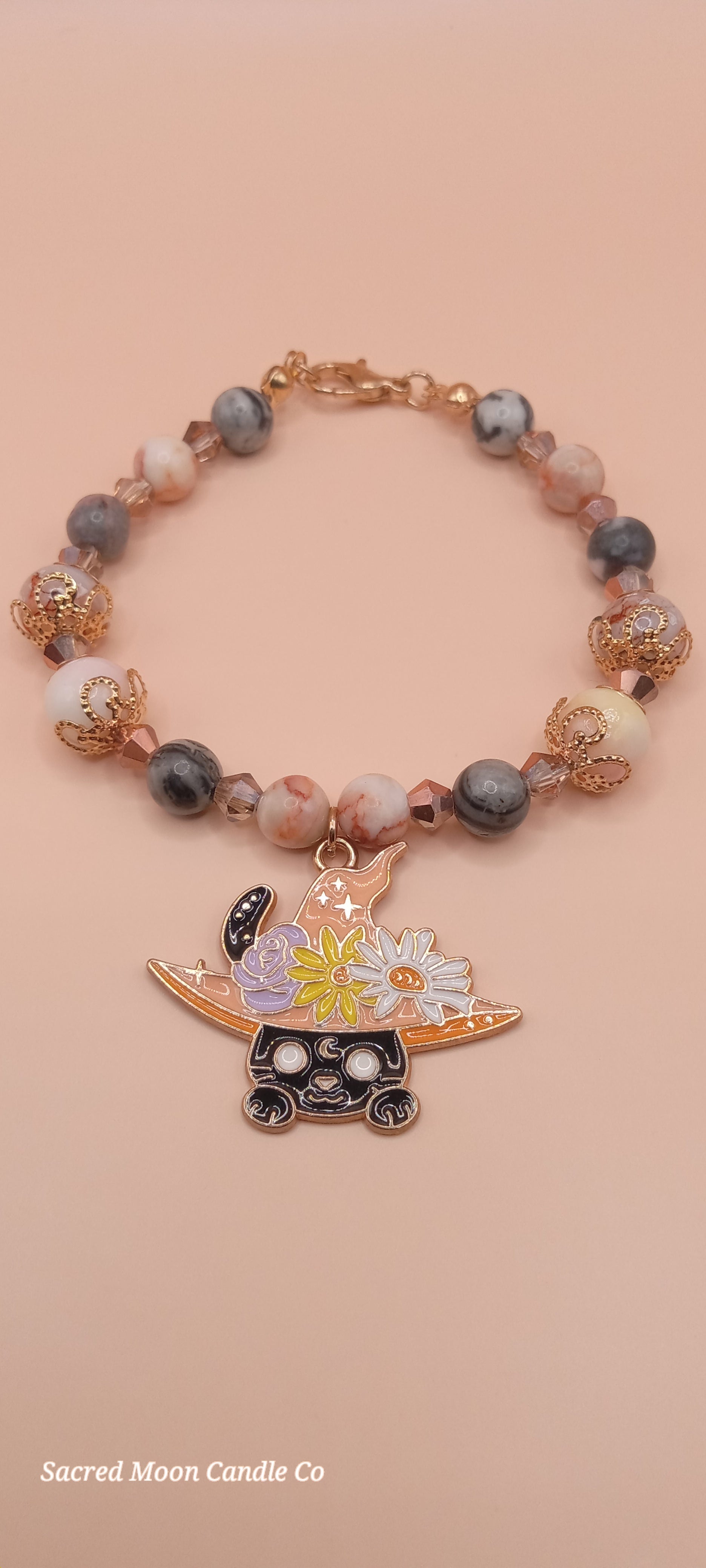 Sacred Moon Candle Co witchy cat charm bracelet with rose gold beads and detailed enamel cat charm